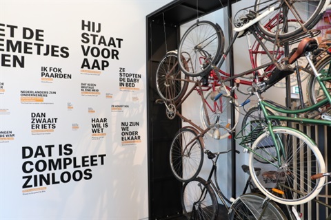 Image of bicycles and language walls inside Oranjehof.