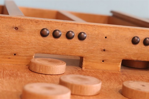Image of Sjoelen game - a wooden game in Oranjehof.